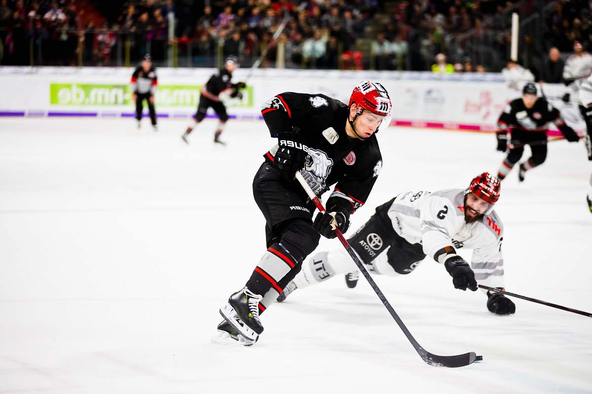human hockey players in hockey field playing hockey