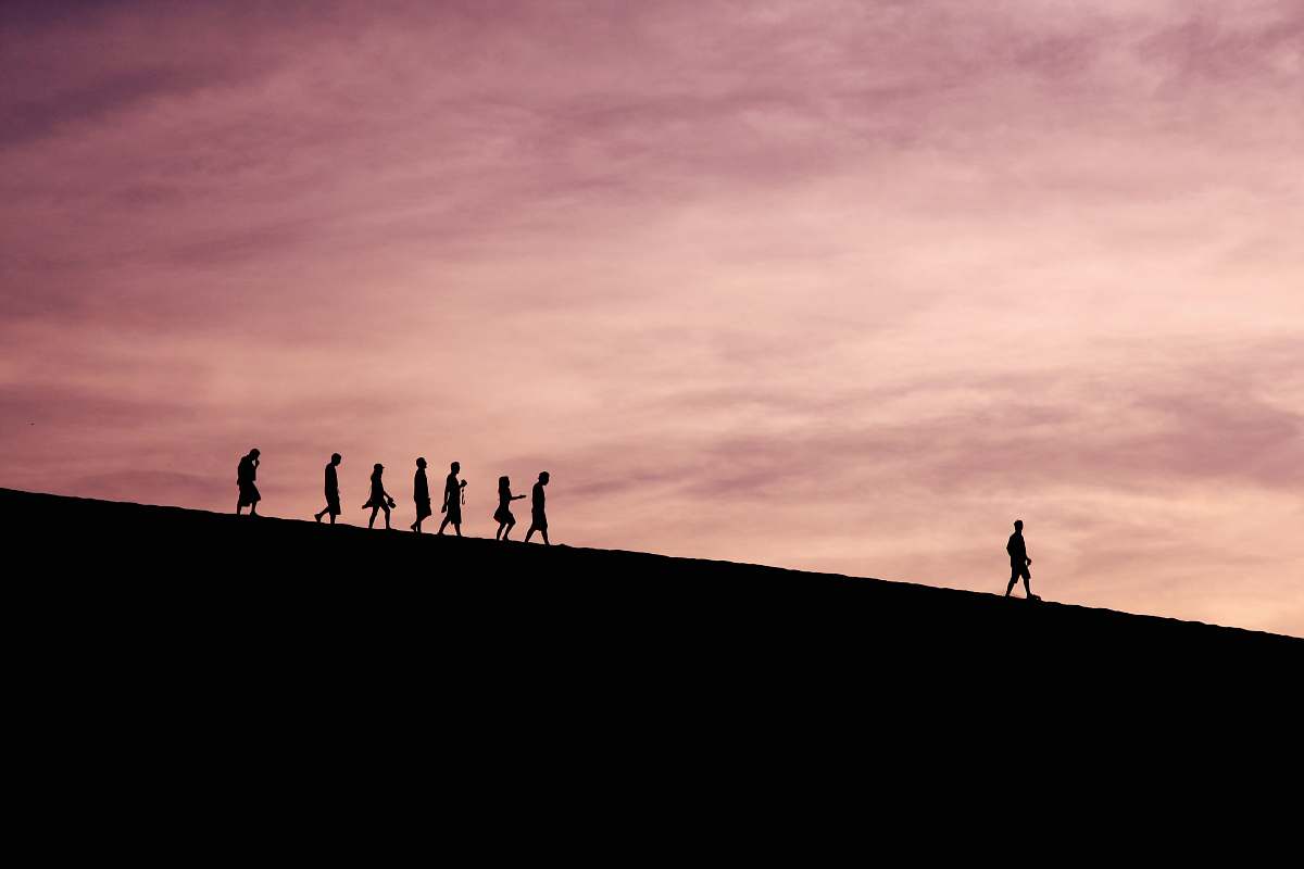 silhouette silhouette of people on hill sky