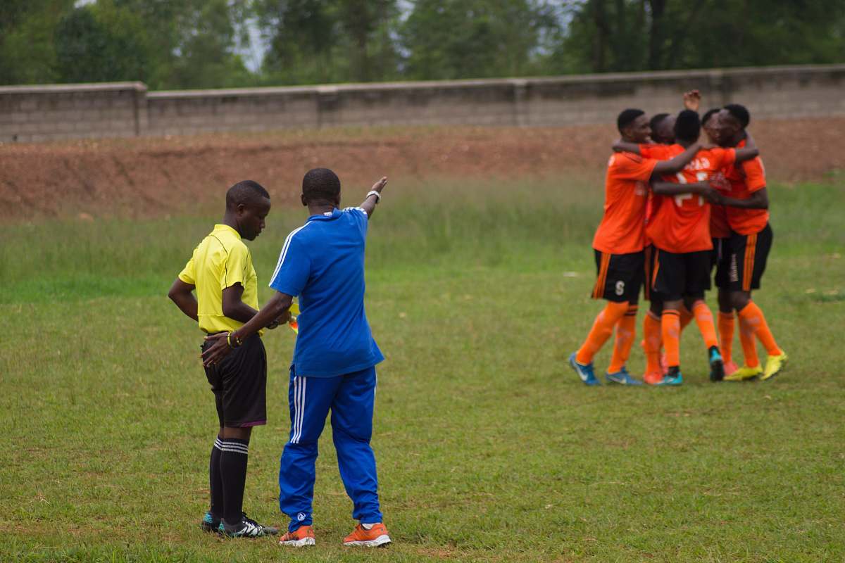 people coach of the other team complaining at the referee team