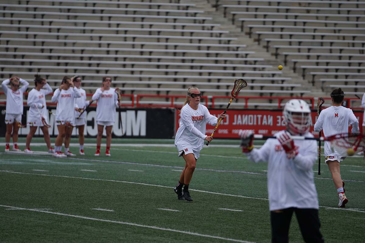 human group of people playing lacrosse game apparel
