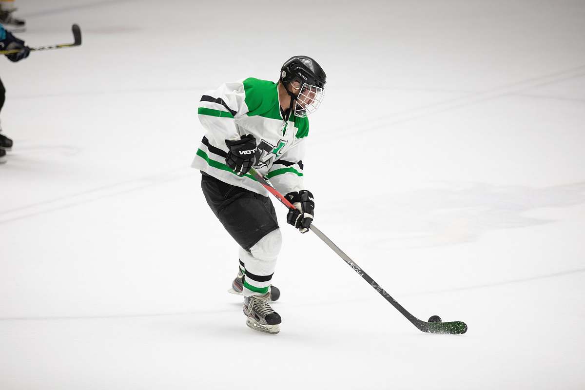 human man playing ice hockey apparel