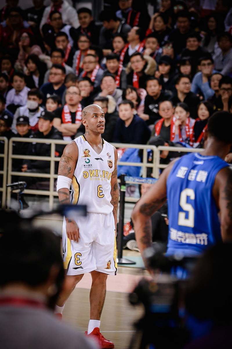 sport man wearing white jersey shirt near man wearing blue jersey shirt basketball
