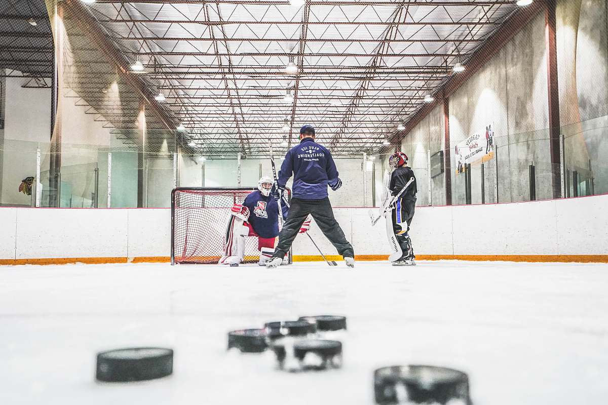 human men playing ice hockey sports