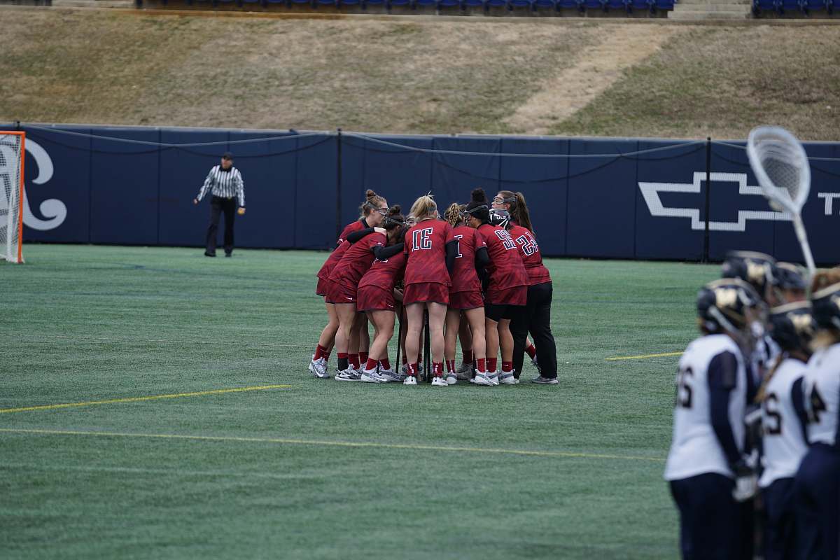 human people having huddle in field during daytime clothing