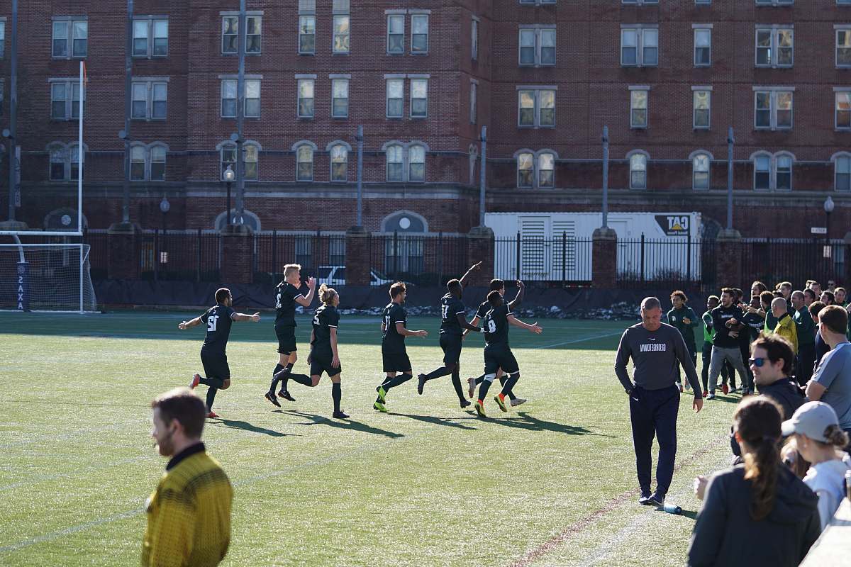 human people playing soccer on the field people