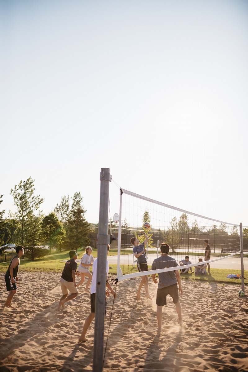 human people playing volleyball people