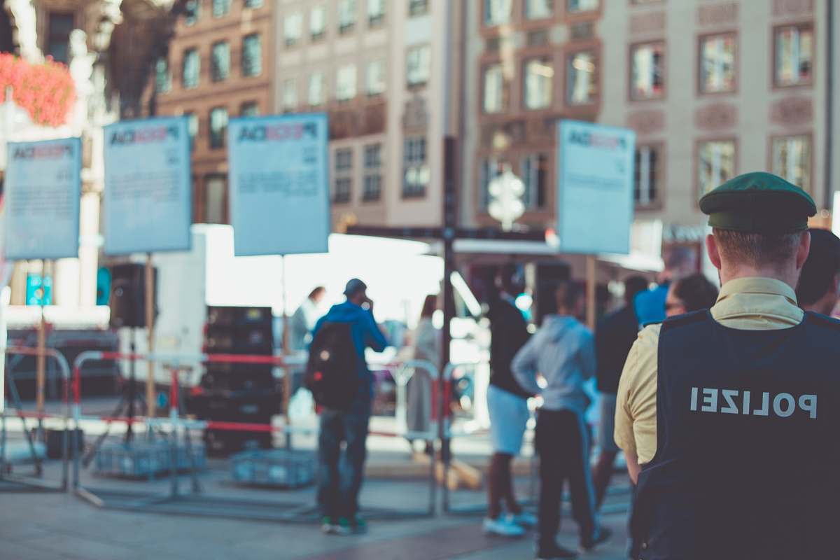 human people walking on road near buildings pedestrian