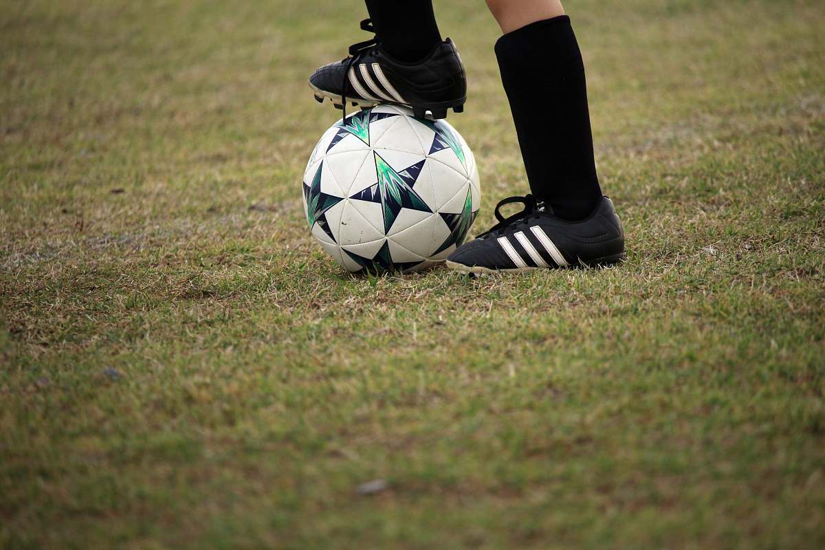 human person playing soccer on field people