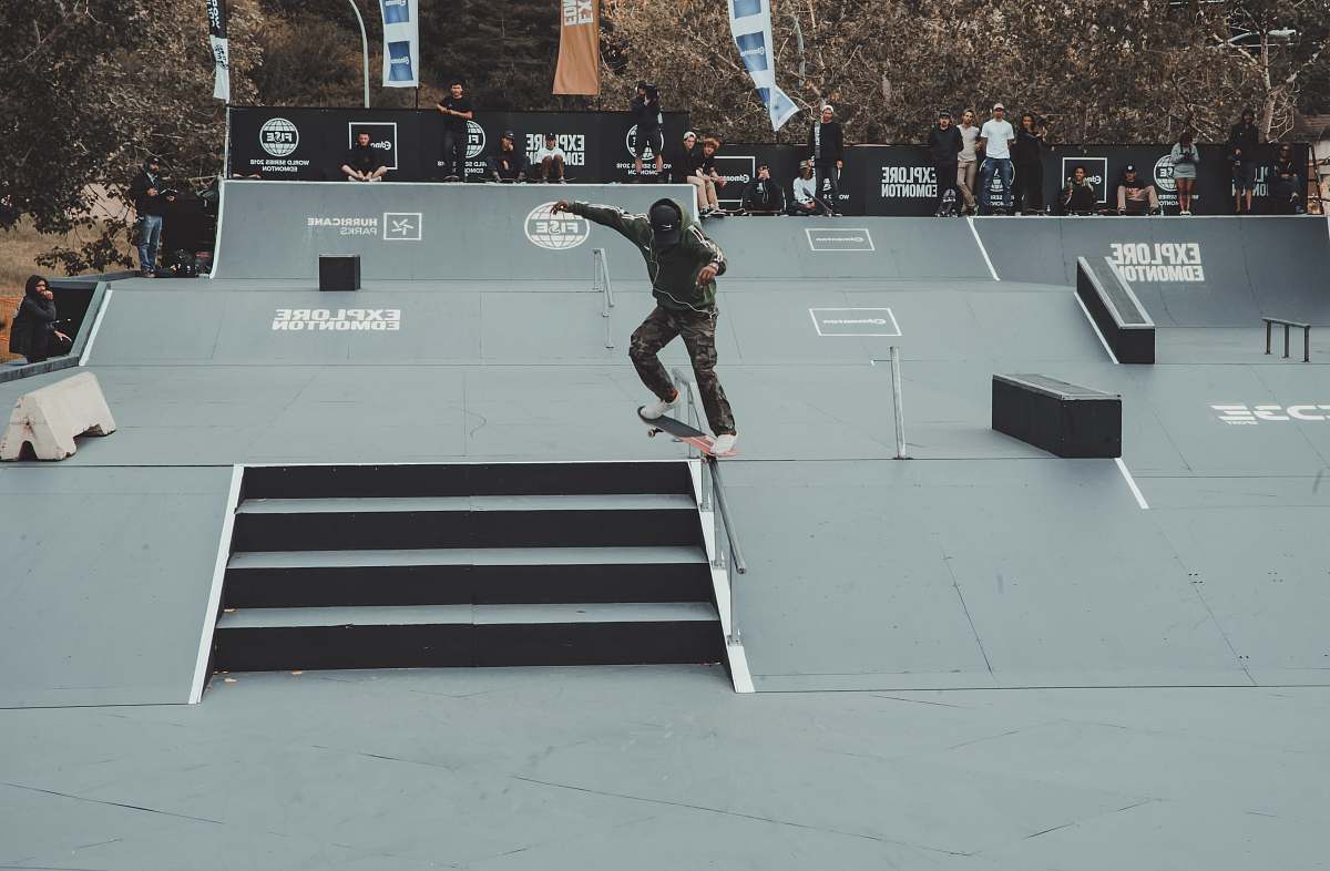 skateboard person skidding skateboard on rail sports