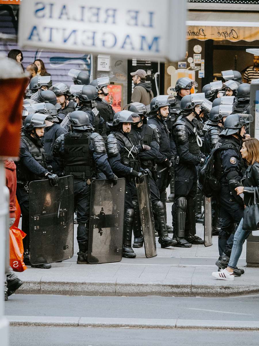 human riot police on street during daytime clothing