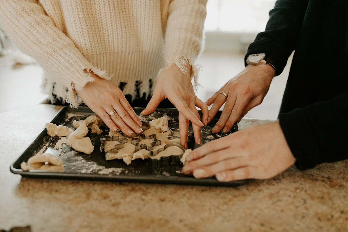 human shallow focus photo of person touching black tray finger