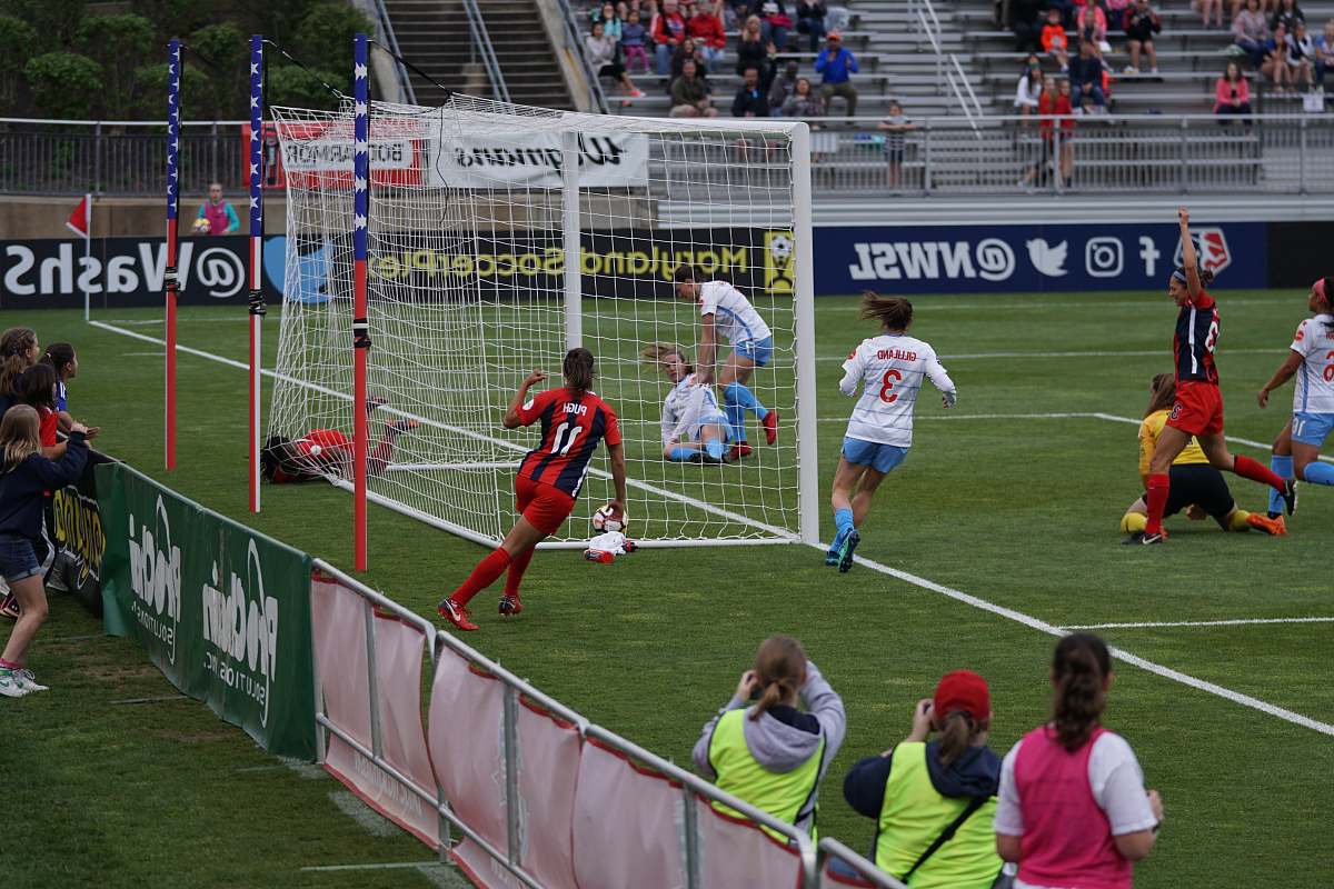 soccer soccer players in field during daytime human