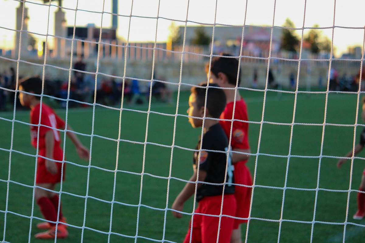 soccer three boys playing soccer human