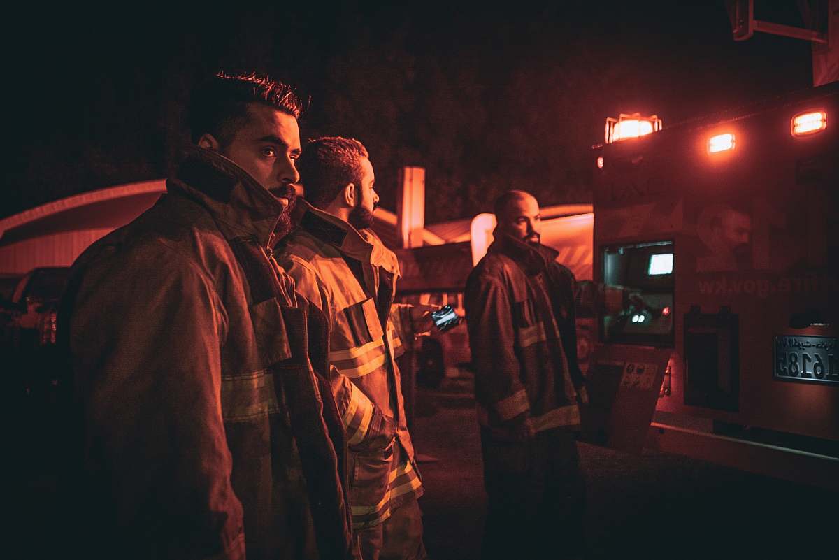 human three fire fighters looking back people