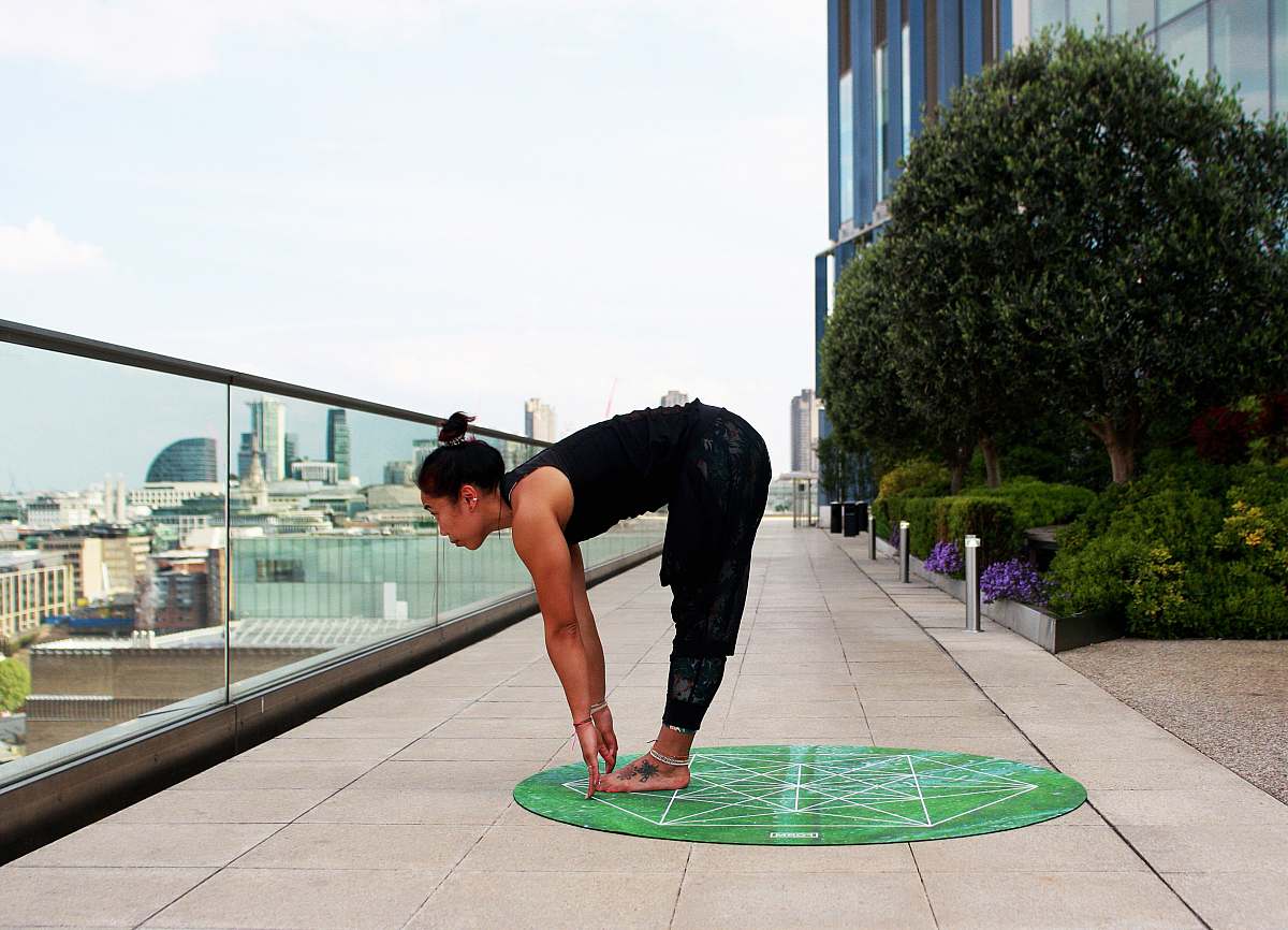 human woman doing yoga touch her feet people