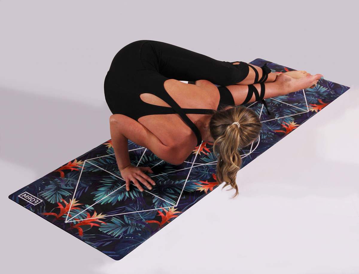human woman dosing yoga on multicolored yoga mat people