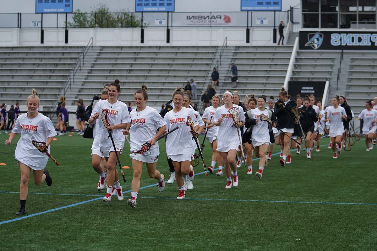 human woman in white shirt playing field hockey people