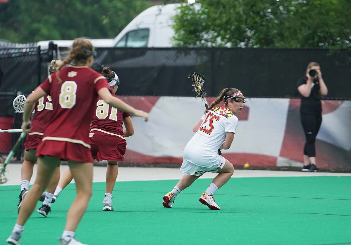 human woman playing lacrosse game people