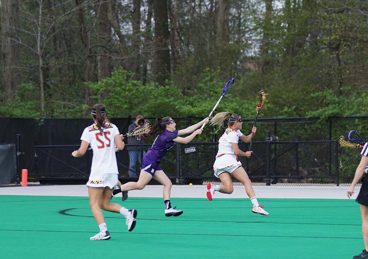 human woman playing lacrosse people