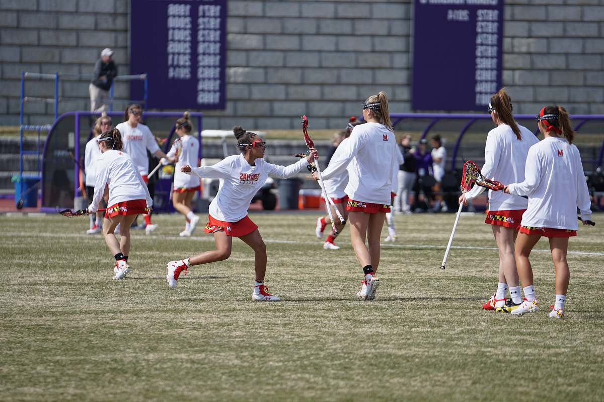 human women about to play on green field apparel