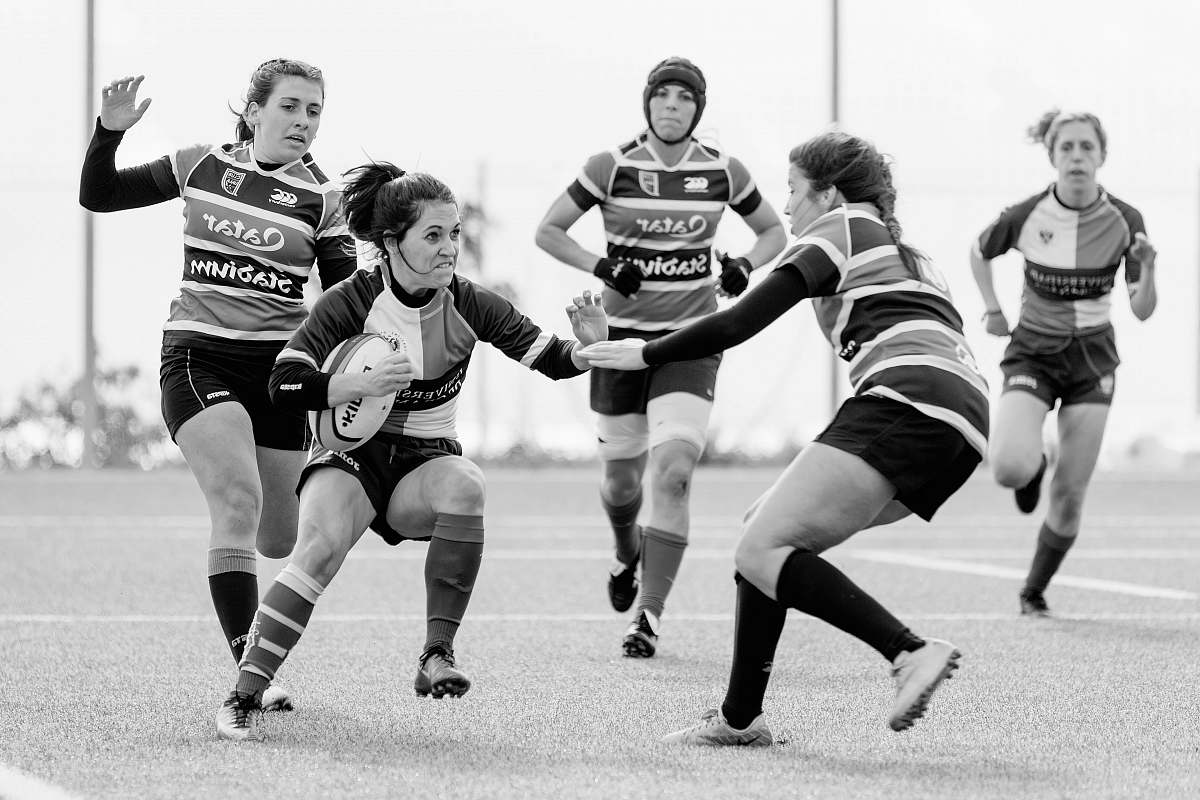 human women playing football black-and-white