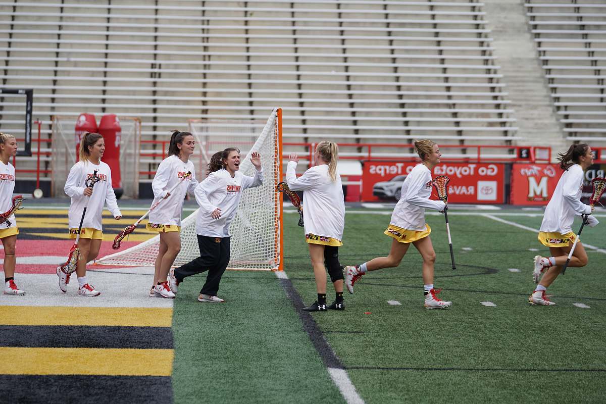 human women walking on field people