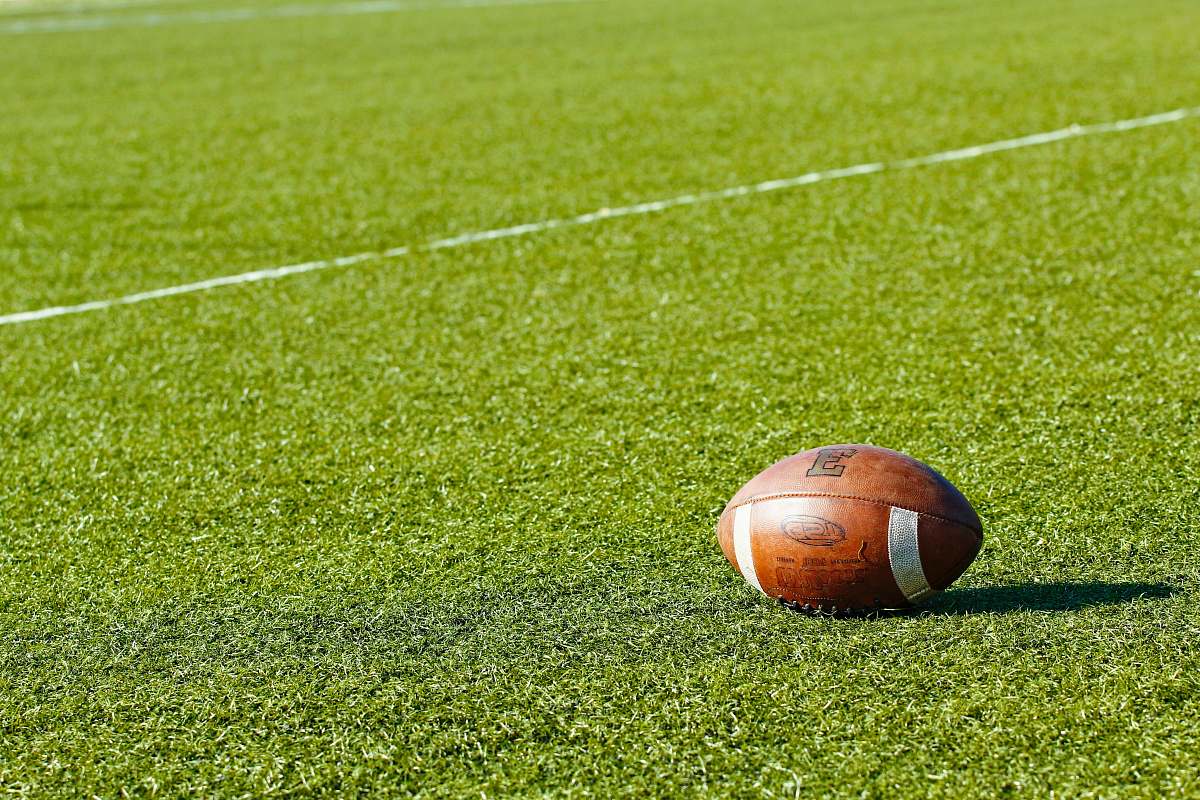 grass football on green field during daytime field