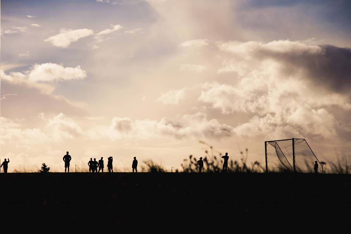 sky people gathering at soccer field cloud