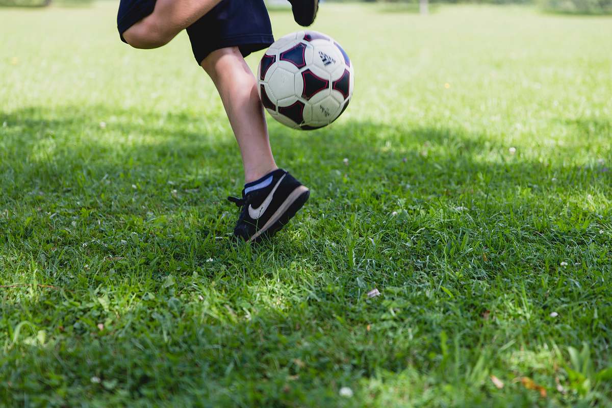 Football Person Running While Kicking The Ball Kicking Image Free Photo