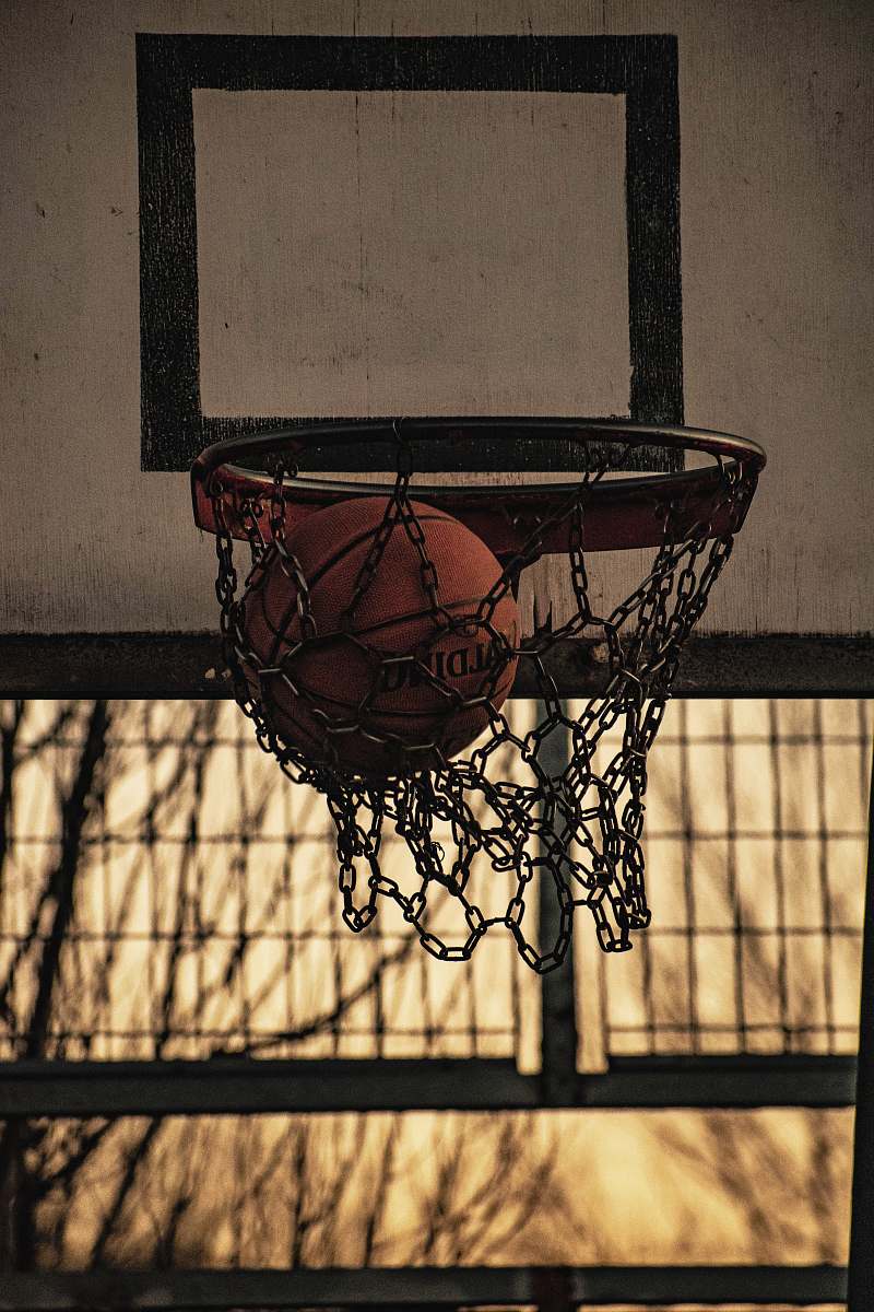 hoop red Spalding basketball ball inside basketball hoop sport