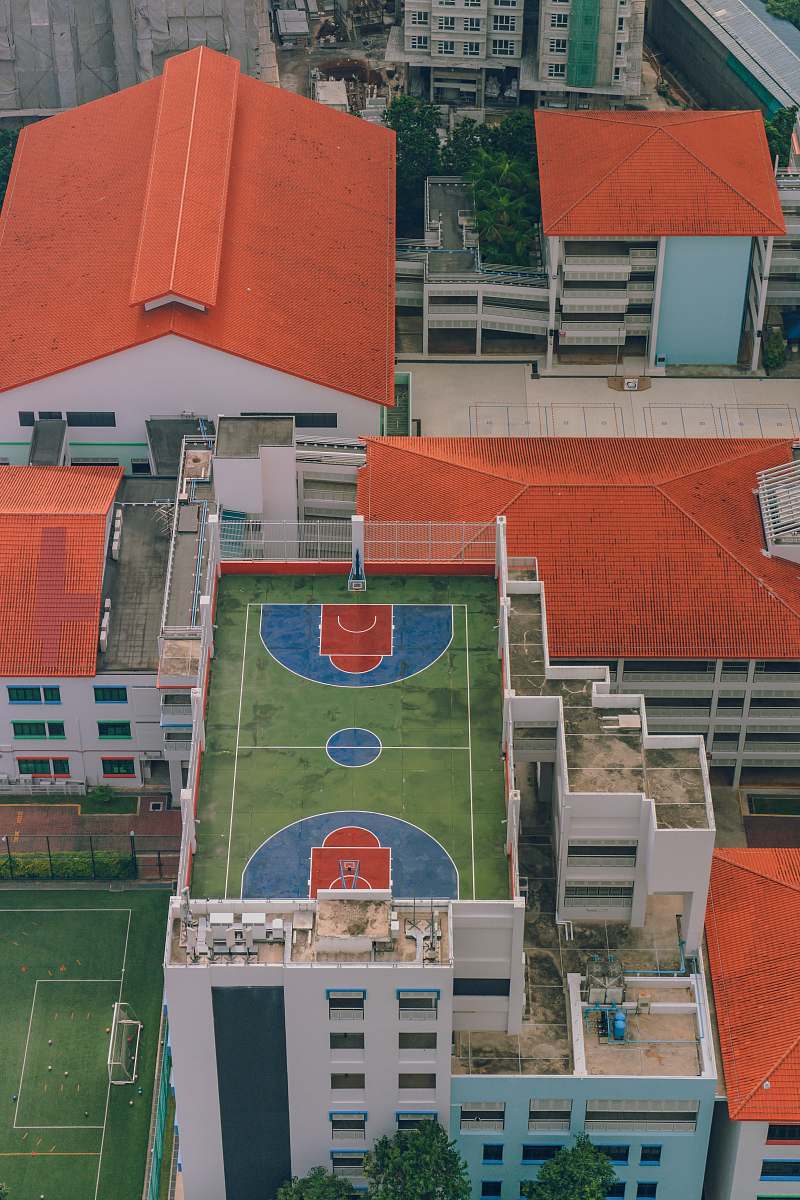 singapore aerial photography of basketball court near houses team sport