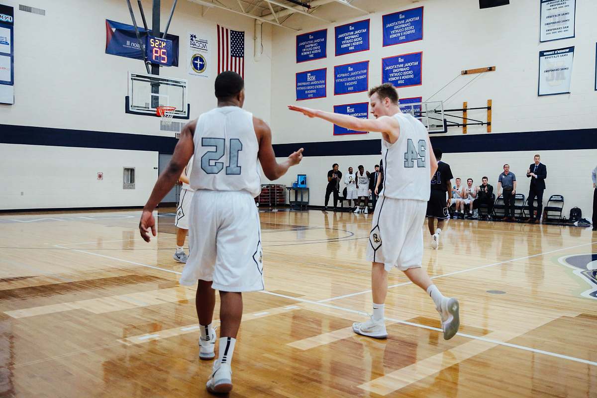 sports basketball players about to give high-fives gym