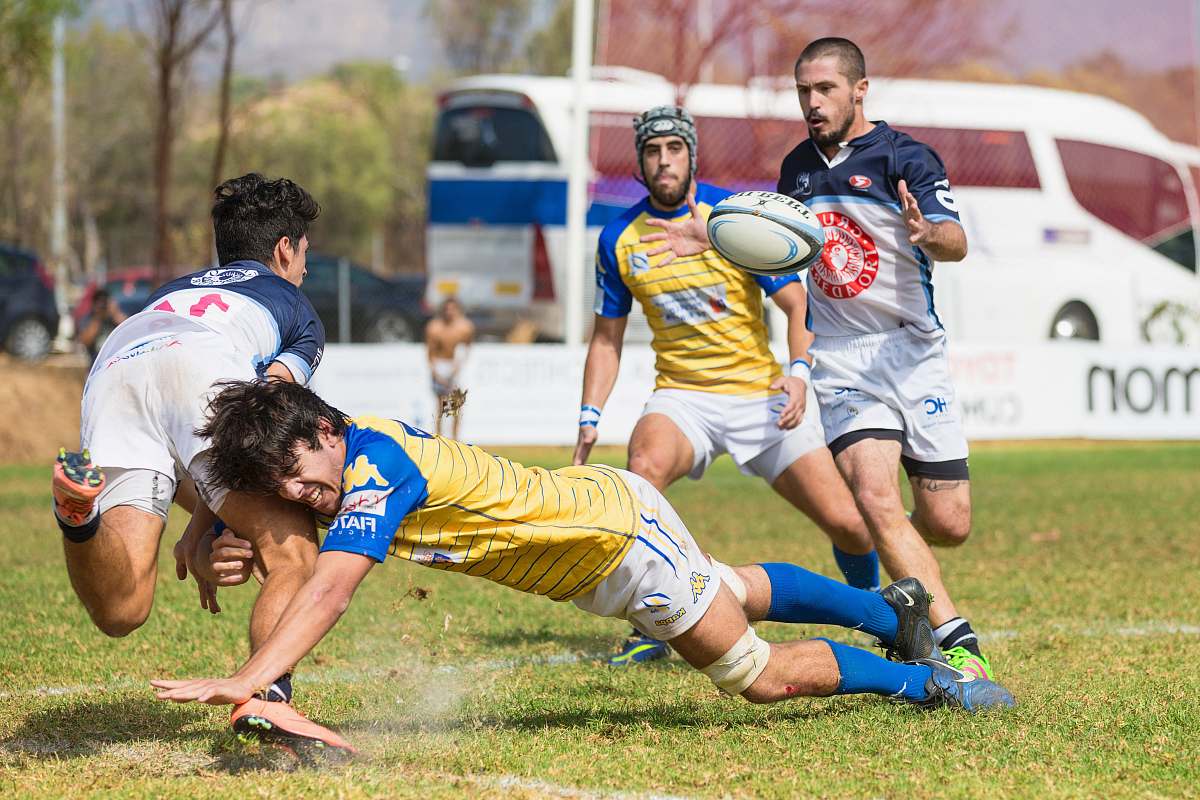 person four men playing soccer sports