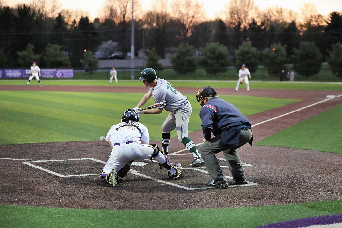 person group of men playing baseball baseball