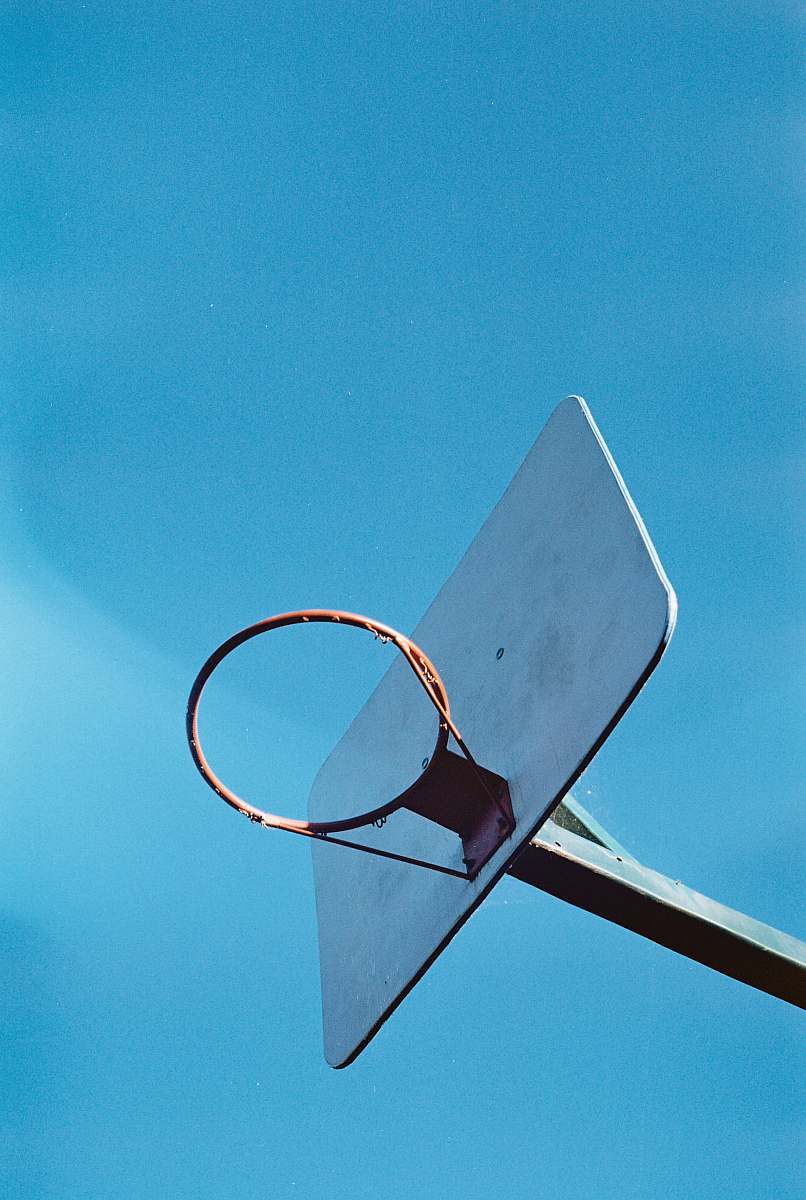 blue low angle photography of basketball hoop hoop
