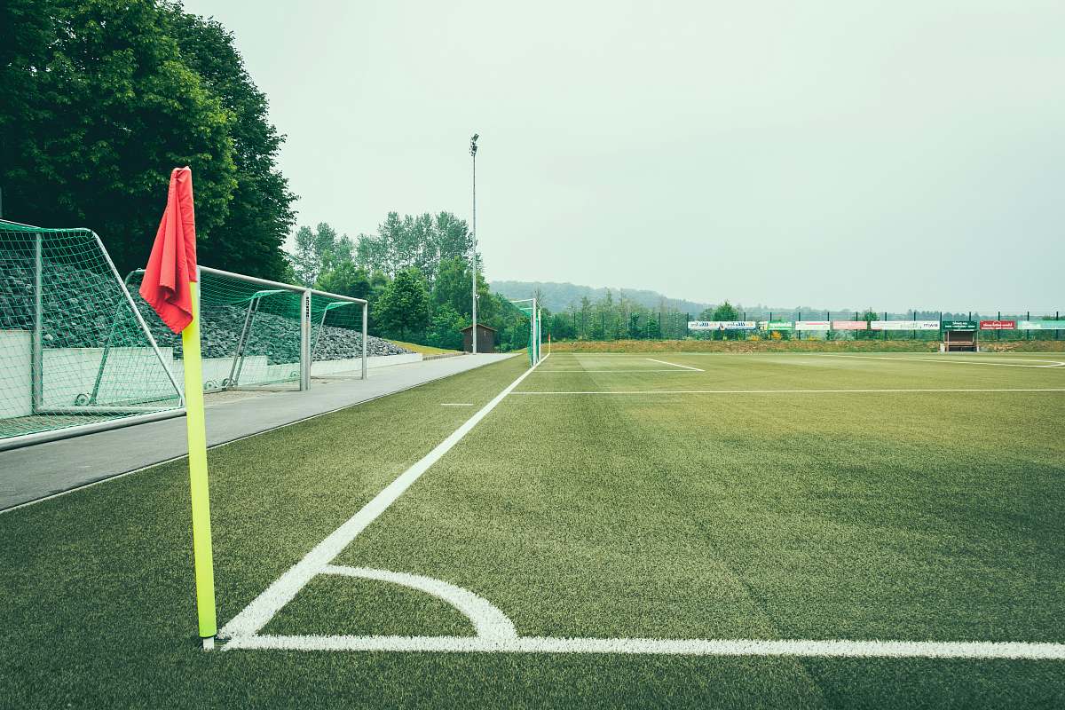 field minimalist photo of soccer field football