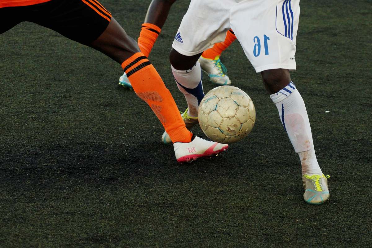 football person playing soccer soccer