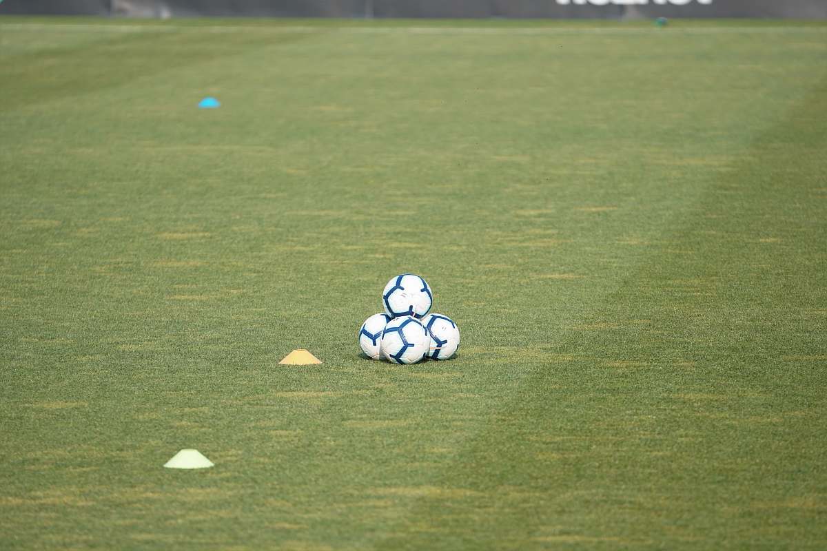sports pile of white-and-blue soccer balls team