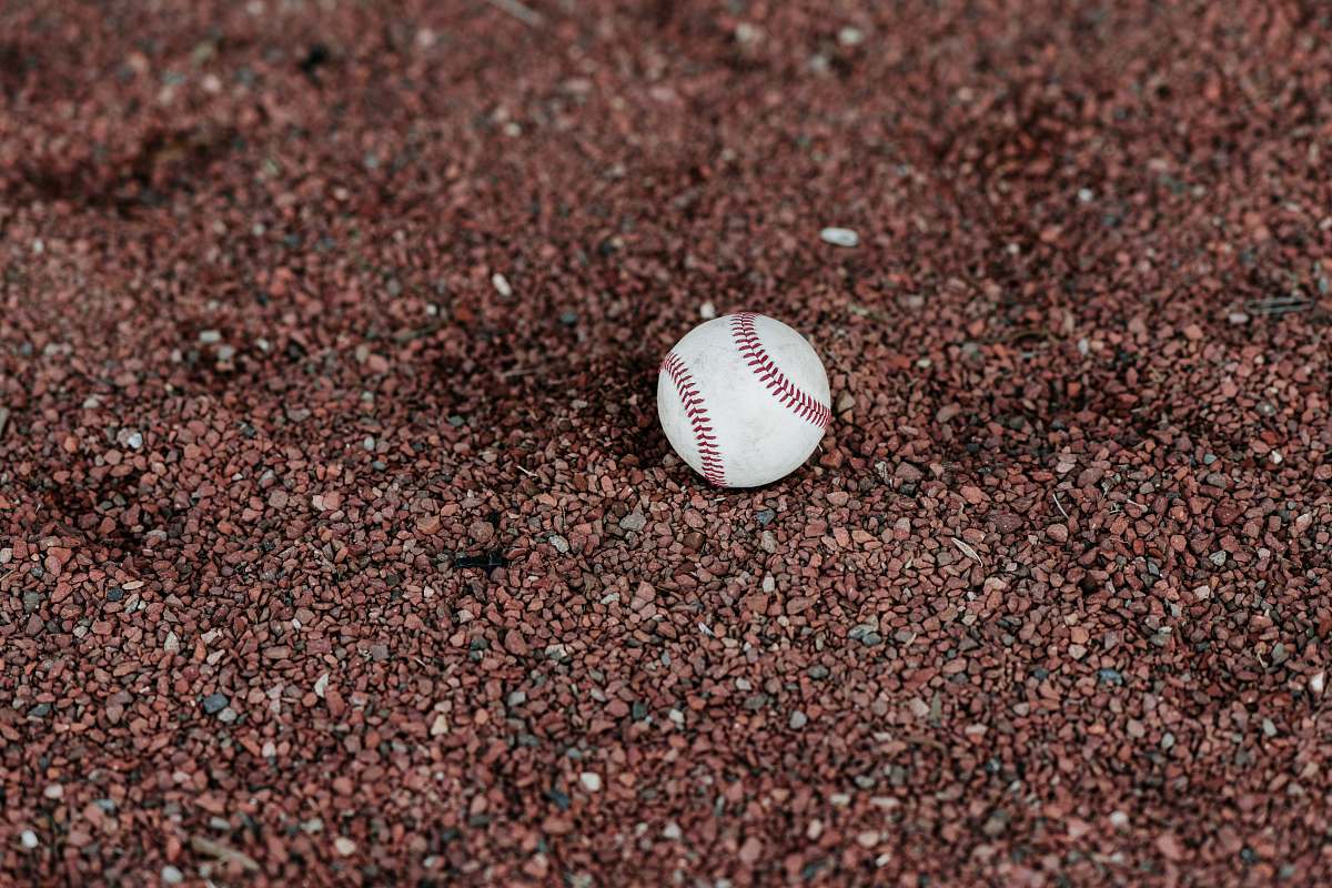 sports white baseball on ground team sport