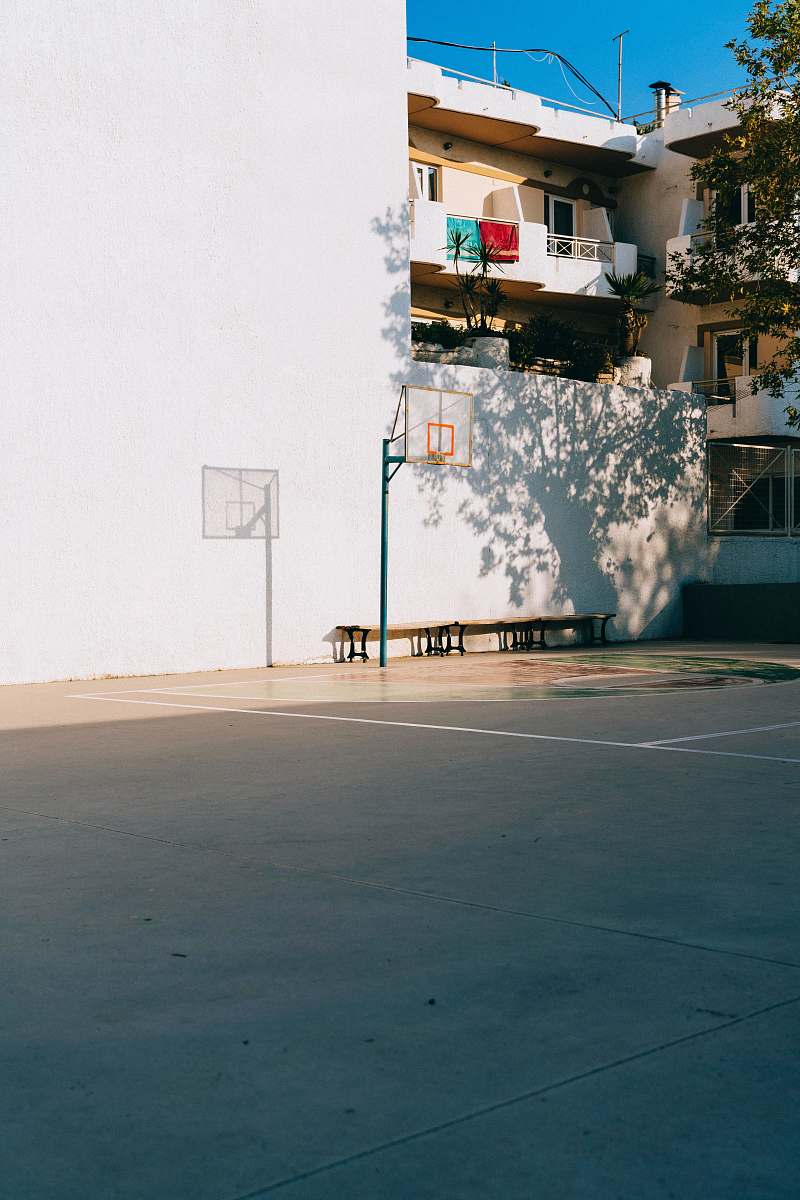 sports white high-rise building during daytime basketball