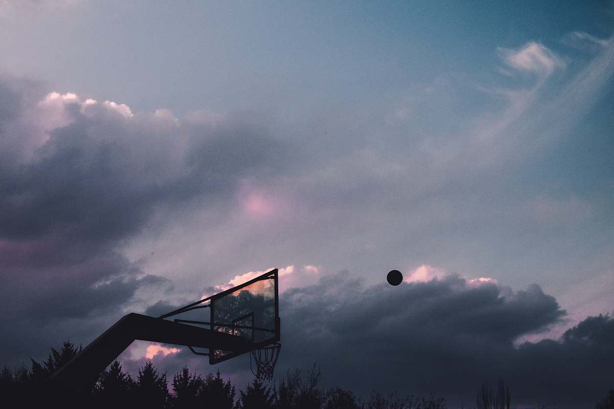 grey basketball ball into the air at the court sport