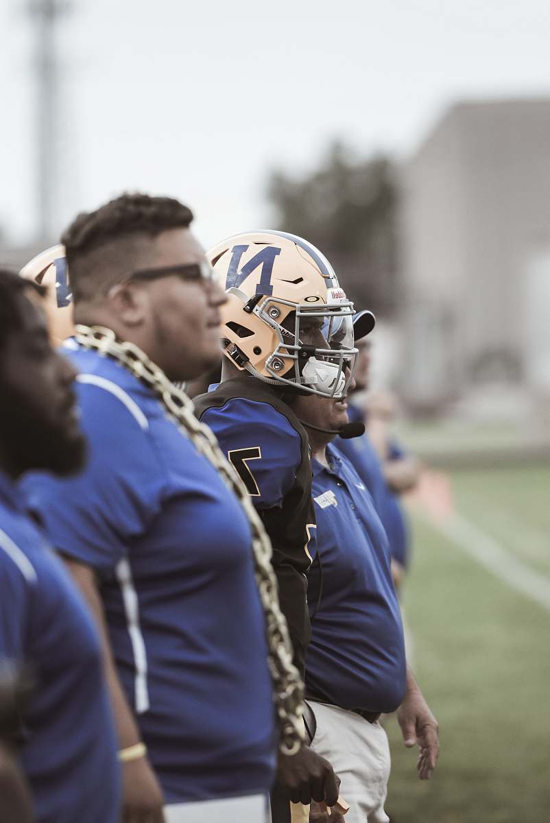 helmet group of football players on field football