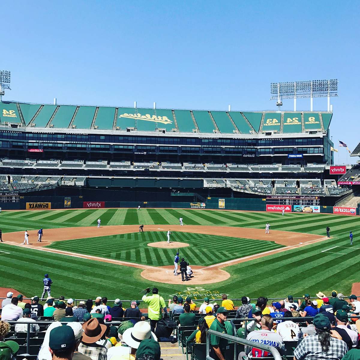 arena photo of people watching game baseball match on baseball field building