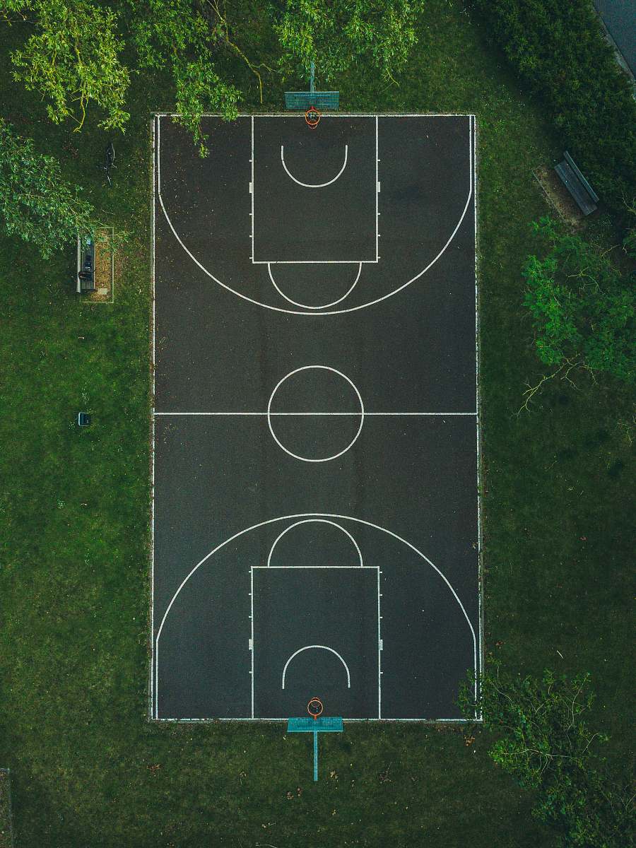 sport basketball court between trees team sport