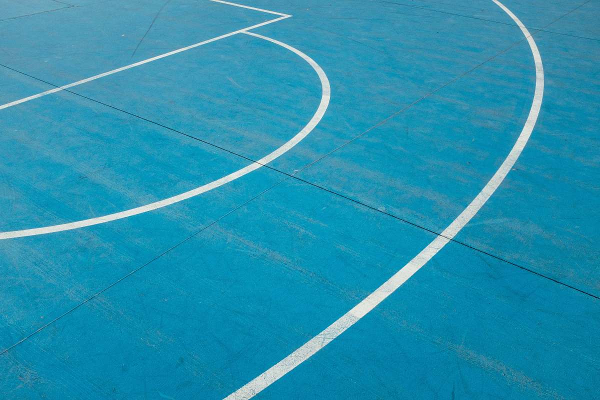 sport white painted lines on blue court floor team sport