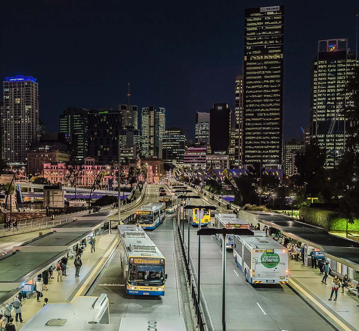 building lighted city with busy street and high-rise buildings city