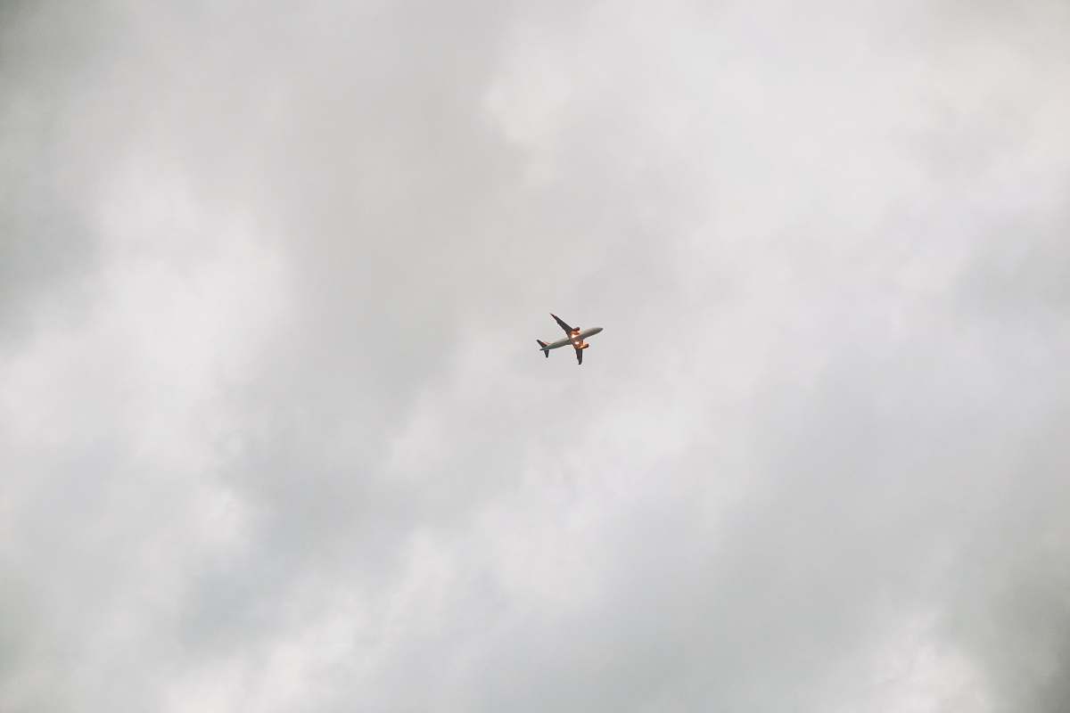 grey airplane in low-angle photo frame black-and-white