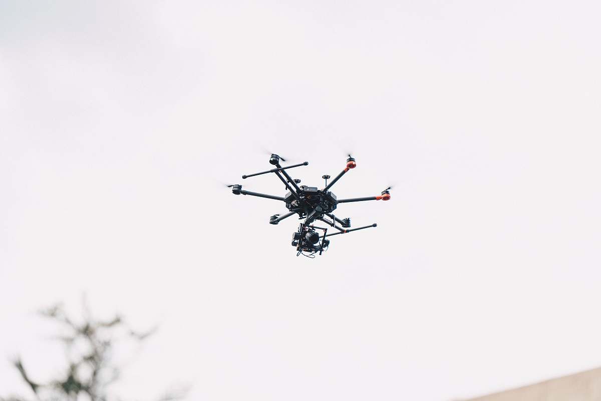 bird black quadcopter drone flying