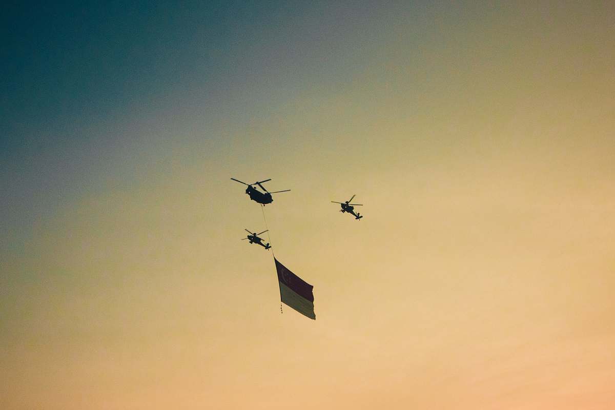 bird three black helicopters at midair flying