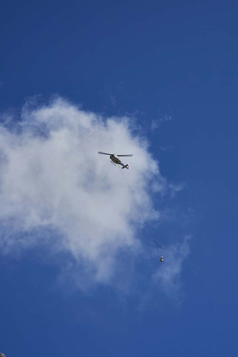animal white helicopter under white clouds flying